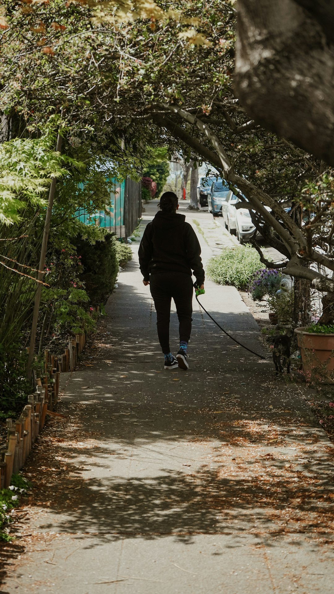 young man walking in neighborhood