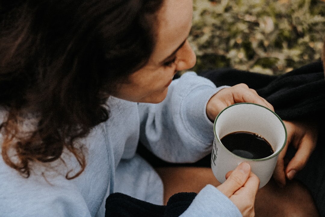 woman sharing coffee with neighbor