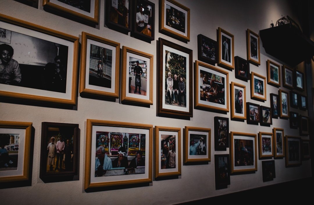 Framed documentary photographs displayed on a gallery wall