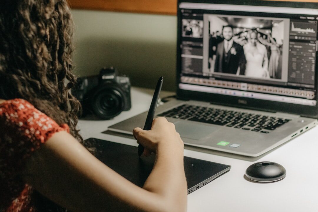 Photo editor working on documentary images on a laptop